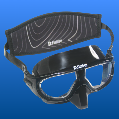 D.finitive Underwater Sports Mask - a black snorkelling mask with "D.finitive" text written in white on the top of the frame. There is a black neoprene strap on the back with a topographical wave design on, and "D.finitive" written along the bottom. Blue gradient background. Used for Underwater Hockey, Underwater Rugby and other underwater sports.